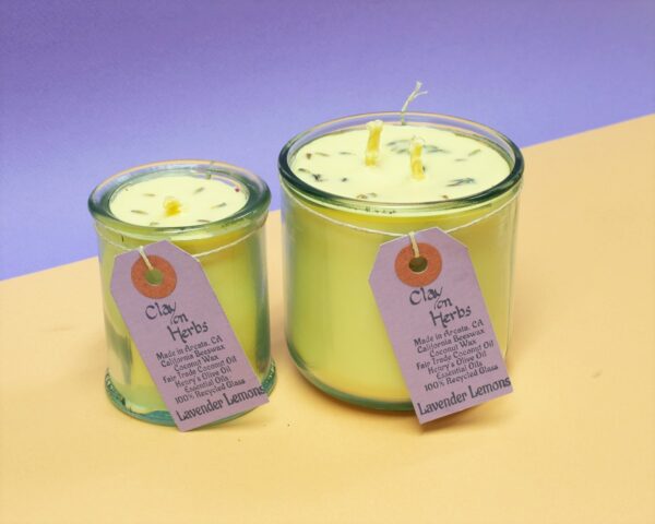 large and small Lavender Lemons candles with a creamsicle and lavender colored backdrop